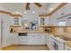 Well-lit kitchen featuring modern appliances, granite countertops, and ample cabinet space at 1200 Gulf Blvd # 1704, Clearwater Beach, FL 33767