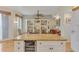 View from the kitchen island, looking into living area with large bookshelf at 1200 Gulf Blvd # 1704, Clearwater Beach, FL 33767