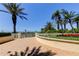 Scenic patio area with lush landscaping, ocean views, and a white fence at 1200 Gulf Blvd # 1704, Clearwater Beach, FL 33767
