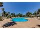 Large outdoor pool surrounded by tropical landscaping and comfortable lounge chairs at 1200 Gulf Blvd # 1704, Clearwater Beach, FL 33767