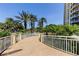 Beautiful walkway through a tropical landscape, leading to the pool and beach at 1200 Gulf Blvd # 1704, Clearwater Beach, FL 33767
