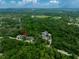 Aerial view showcasing the home and the green surrounding trees at 12208 Mcmullen Loop, Riverview, FL 33569