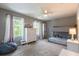 Spacious bedroom with a bunk bed, large windows, and a ceiling fan providing a cozy atmosphere at 12208 Mcmullen Loop, Riverview, FL 33569