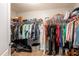Walk-in closet with organized clothing racks and storage shelves for ample space at 12208 Mcmullen Loop, Riverview, FL 33569