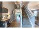 Foyer with staircase and view of dining area offers a warm welcome to the home at 12208 Mcmullen Loop, Riverview, FL 33569