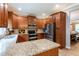 Stylish kitchen features granite countertops and stainless steel appliances, plenty of storage space at 12208 Mcmullen Loop, Riverview, FL 33569