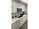 Updated kitchen featuring modern appliances, quartz countertops, and ample cabinetry at 1221 Drew St # C2, Clearwater, FL 33755