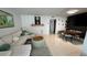 Open floor plan featuring living room and dining area with modern decor at 1221 Drew St # C2, Clearwater, FL 33755