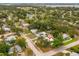 An overhead shot of the property, showing the surrounding neighborhood, tree coverage, and proximity to the water at 1242 74Th N St, St Petersburg, FL 33710