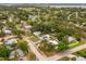An overhead shot of the property, showing the surrounding neighborhood, tree coverage, and proximity to the water at 1242 74Th N St, St Petersburg, FL 33710
