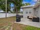 Backyard patio with an outdoor seating area and grill at 1242 74Th N St, St Petersburg, FL 33710