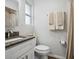 Clean bathroom featuring a granite-topped vanity, a shower, and neutral-colored towels at 1242 74Th N St, St Petersburg, FL 33710