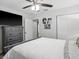 Bright bedroom featuring a full bed, closet, ceiling fan, and modern decor at 1242 74Th N St, St Petersburg, FL 33710