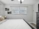 Bright bedroom featuring two windows and a ceiling fan at 1242 74Th N St, St Petersburg, FL 33710