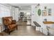 Inviting entryway showcasing wood-look tile floors and seamless access to the updated kitchen at 1242 74Th N St, St Petersburg, FL 33710