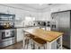 Beautiful kitchen featuring updated appliances and eat-in island at 1242 74Th N St, St Petersburg, FL 33710