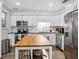 Updated kitchen featuring stainless steel appliances, ample counter space, and eat in island at 1242 74Th N St, St Petersburg, FL 33710