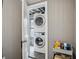 Convenient laundry room featuring a stacked washer and dryer at 1242 74Th N St, St Petersburg, FL 33710