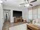 Inviting living room featuring a large television and seamless flow to the hallway at 1242 74Th N St, St Petersburg, FL 33710