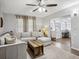 Comfortable living room with a large sectional sofa and access to the sunroom at 1242 74Th N St, St Petersburg, FL 33710