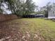 Open backyard area showcasing a covered parking spot and a boat at 12426 Terra Ceia Ave, New Port Richey, FL 34654