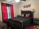 Comfortable bedroom with a full-sized bed, elegant furniture, and inviting decor at 12426 Terra Ceia Ave, New Port Richey, FL 34654