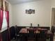 Charming dining area with a table set for four, perfect for Gathering meals at 12426 Terra Ceia Ave, New Port Richey, FL 34654