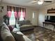 Bright living room features stylish flooring, neutral decor, and ample natural light at 12426 Terra Ceia Ave, New Port Richey, FL 34654