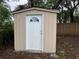 Exterior view of an outdoor storage shed with a white door at 12426 Terra Ceia Ave, New Port Richey, FL 34654