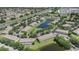 Aerial view of townhomes near a pond with a community pool and easy highway access at 12437 Foxmoor Peak Dr, Riverview, FL 33579