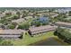 Aerial view of townhomes near a pond with a community pool and easy highway access at 12437 Foxmoor Peak Dr, Riverview, FL 33579
