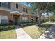 Exterior view showcasing the townhouse's entrance, landscaping, and inviting pathway at 12437 Foxmoor Peak Dr, Riverview, FL 33579