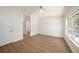 Spacious main bedroom with a ceiling fan and wood-look floors at 12437 Foxmoor Peak Dr, Riverview, FL 33579
