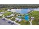 Overhead view of the community park showcasing a splash pad, playground, lake boardwalk, picnic area and parking at 13612 S Village Dr # 5201, Tampa, FL 33618