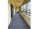 Spacious screened balcony with a view of the surrounding landscape and parking area at 13612 S Village Dr # 5201, Tampa, FL 33618
