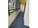 Relaxing screened balcony with lush green views of the outdoor landscaping and scenery at 13612 S Village Dr # 5201, Tampa, FL 33618