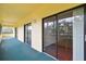 Covered outdoor patio with multiple sliding glass doors for indoor/outdoor living at 13612 S Village Dr # 5201, Tampa, FL 33618