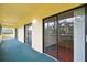 Covered outdoor patio with multiple sliding glass doors for indoor/outdoor living at 13612 S Village Dr # 5201, Tampa, FL 33618