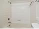 Clean bathroom with white tiled shower/tub combo and updated fixtures at 13612 S Village Dr # 5201, Tampa, FL 33618