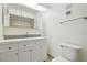 Bathroom featuring white vanity, mirror, and updated fixtures at 13612 S Village Dr # 5201, Tampa, FL 33618