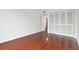 Bedroom featuring wood floors, closet space and white walls at 13612 S Village Dr # 5201, Tampa, FL 33618