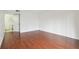 Spacious bedroom featuring wood floors, bright white walls, and a private bathroom at 13612 S Village Dr # 5201, Tampa, FL 33618