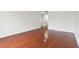 Bright bedroom featuring hard wood floors, bright white walls, and ample space at 13612 S Village Dr # 5201, Tampa, FL 33618