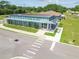Modern community center with a metal pergola, clean architecture, and inviting entrance, set in a green lawn area at 13612 S Village Dr # 5201, Tampa, FL 33618