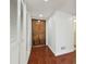 Welcoming entryway featuring wood floors, front door and closet space at 13612 S Village Dr # 5201, Tampa, FL 33618