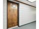 Hallway view of unit door with unit number, neutral carpeting, and light wall at 13612 S Village Dr # 5201, Tampa, FL 33618