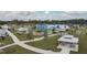 Overhead aerial view showcasing shaded picnic shelters and colorful playgrounds with a lake and boardwalk in the distance at 13612 S Village Dr # 5201, Tampa, FL 33618