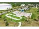 Aerial view of skate park with ramps, rails, and green space, providing recreational opportunities in the community at 13612 S Village Dr # 5201, Tampa, FL 33618