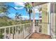 Balcony with views of palm trees and the surrounding landscape at 1501 Doyle Carlton Dr # 303, Tampa, FL 33602