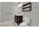 Well-lit bathroom with a modern vanity, round mirror, and toilet for a fresh look at 1501 Doyle Carlton Dr # 303, Tampa, FL 33602